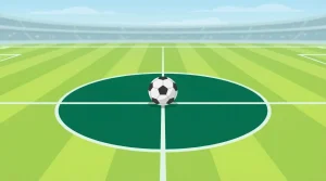 Fußball auf dem Anstoßpunkt eines grünen Spielfeldes mit klaren Linien